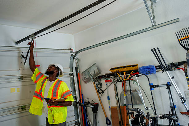 Professional Garage Door Panel Replacement technician working in Halls, TN
